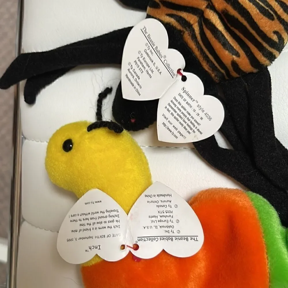 5 beanie babies.  Hissy, Spinner, Smoochy, Inch, Rainbow.